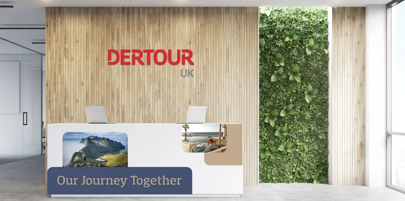 DerTour UK reception brand experience, the red wordmark on a timber wall.